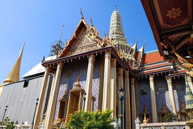 Angkor Wat 2-Day Tour from Bangkok - Bayon’s stone faces and Ta Prohm’s tree-covered ruins