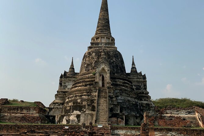 Ayutthaya Sunset Boat Ride & Famous Attraction From Bangkok - Wat Mahathat and the Buddha in the tree roots