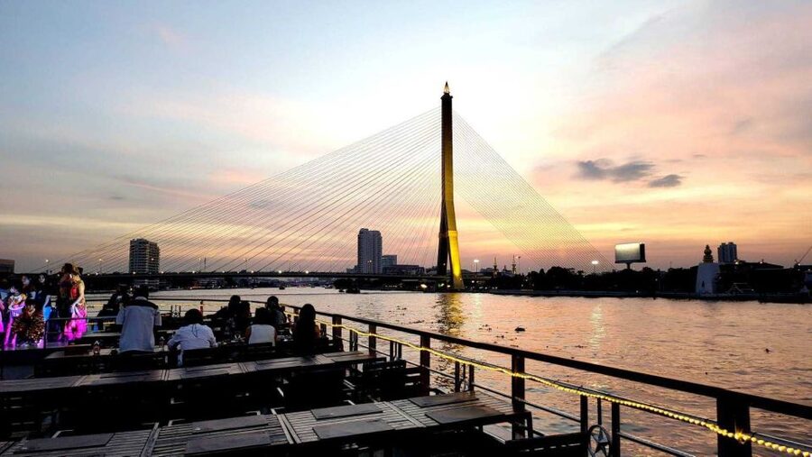 Bangkok: Calypso x White Orchid Cruise with Private Transfer - Bangkok from the river at golden hour