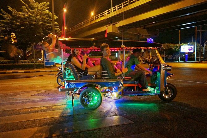 Bangkok Under the Night Lights by TUK-TUK (SHA Plus) - The Grand Palace Lit Up From the Road