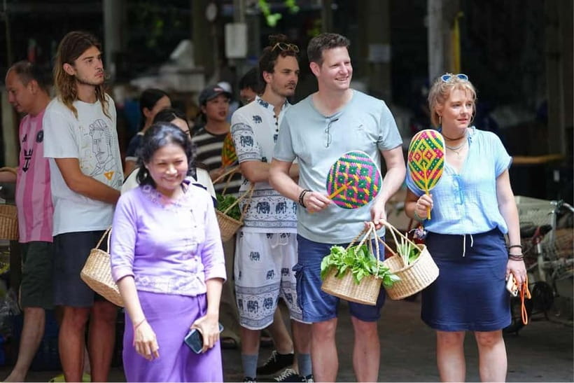 Bangkok: White Lotus Thai Cooking Class with Market Tour - A cozy kitchen with a social side