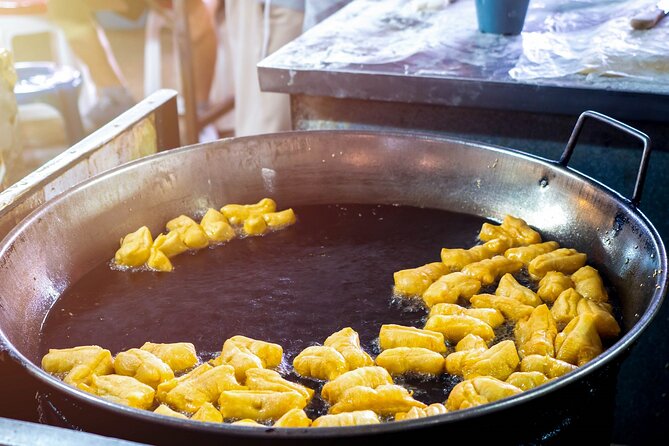 Chiang Mai Michelin Food Walking Tour with Professional Tour Guide - Go Neng and Chiang Mai’s dinosaur-shaped pa tong go