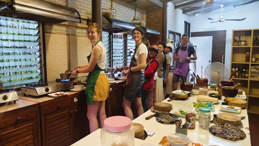 Chiang Mai: Morning Cooking Class with Market Visit - Picking herbs in the organic garden