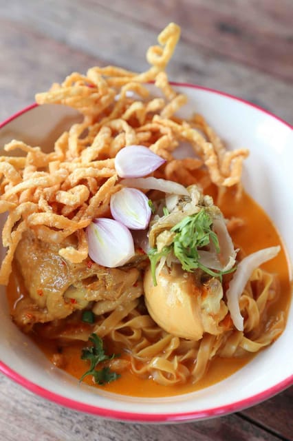 Chiang Mai : Traditional Northern Cooking Class - Mixing a pork chili sauce with balance
