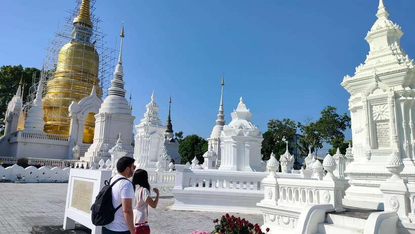 Chiang Mai: Tuk-Tuk Evening Tour with Temples & Street Foods - Tuk-tuk streets, moat walls, and Old City context