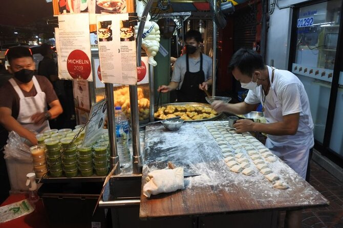 Chinatown Street Food Night Tour by Tuk Tuk in Bangkok - Wat Ratchanatdaram and a Grand Palace view