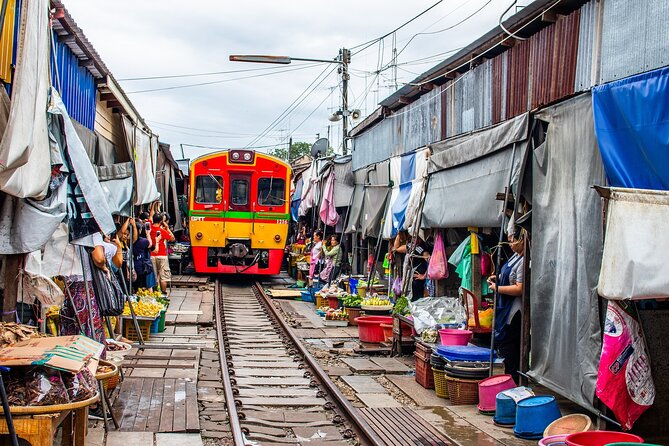 Damnoen Saduak Floating Market and Maeklong Railway Market Tour - Wat Bang Kung and the banyan-wrapped chapel