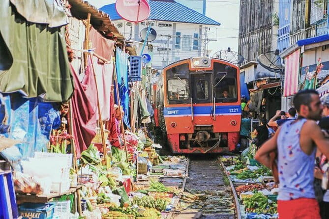 Damnoen Saduak Floating Market & Railway Market Tour from Bangkok - Maeklong Railway Market and the train through the stalls