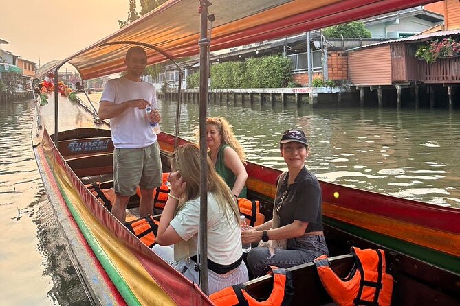 Discover Hidden Bangkok with Longtail Boat Tour - The Big Buddha of Wat Paknam from the water