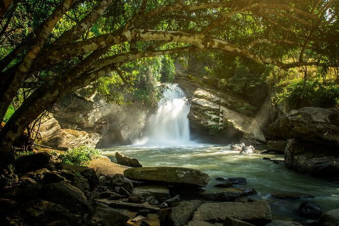 Elephant Sanctuary + Waterfall + Bamboo Rafting One Day Trip - Cooling off at a 20-meter waterfall