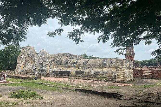 Explore Ancient Ayutthaya Historical Park Day Tour in Bangkok - Wat Mahathat and the Buddha in the roots