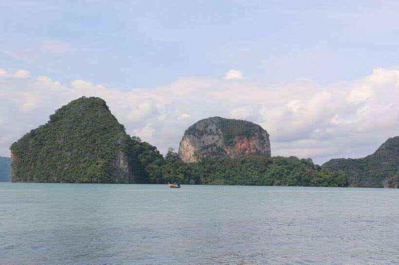 Khaolak: Phang Nga Bay, Tapu Island, and Panyi Village Tour - Leaving the pier by traditional long-tail boat