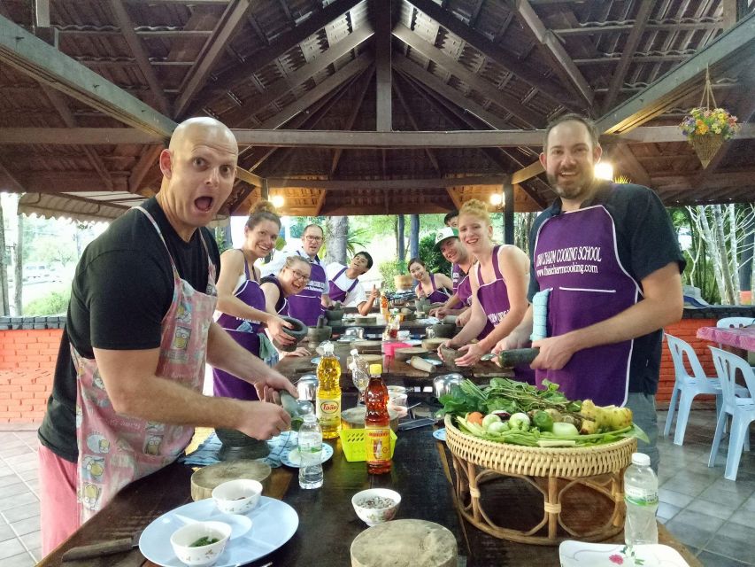Krabi: Cooking Class at Thai Charm Cooking School with Meal - Two desserts and a very full table