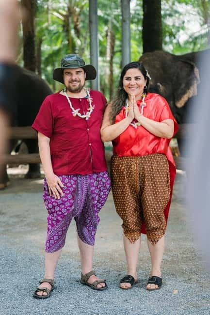 Krabi: Elephant Feeding Program with Traditional Thai Dress - Preparing bananas or sugar cane for the elephants