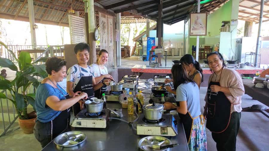 Krabi: Morning/Afternoon Thai Cooking Class at Ya's Cookery - Cooking Thai food beside a small Krabi stream