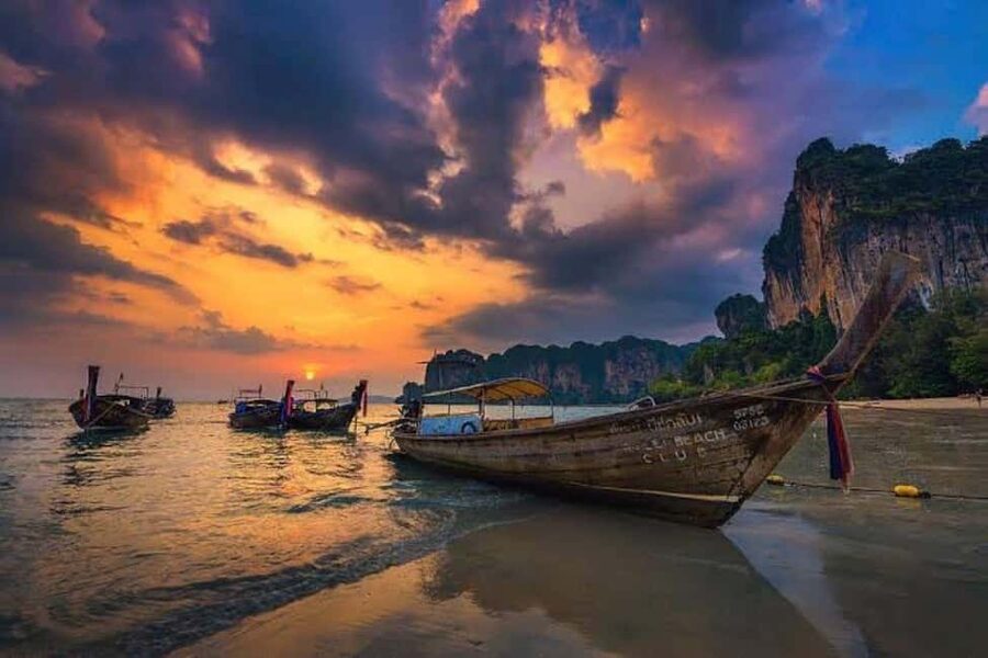 Krabi: Railay Sunset and Bioluminescent Plankton Tour - Leaving Ao Nang on a traditional longtail boat