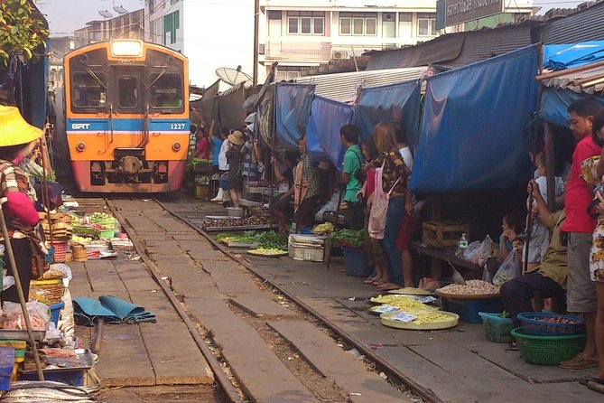 Maeklong & Damnoen Saduak Markets: Railway & Floating Market Tour - Maeklong Railway Market and the train that cuts through it