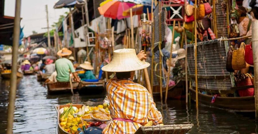 The Old Siam: Damnoen Saduak and Maeklong Railway Market - Maeklong Railway Market: where the train shares the aisle